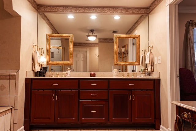 full bathroom featuring visible vents, a sink, crown molding, and double vanity