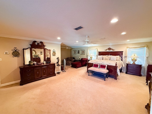 bedroom with recessed lighting, visible vents, light colored carpet, and ornamental molding