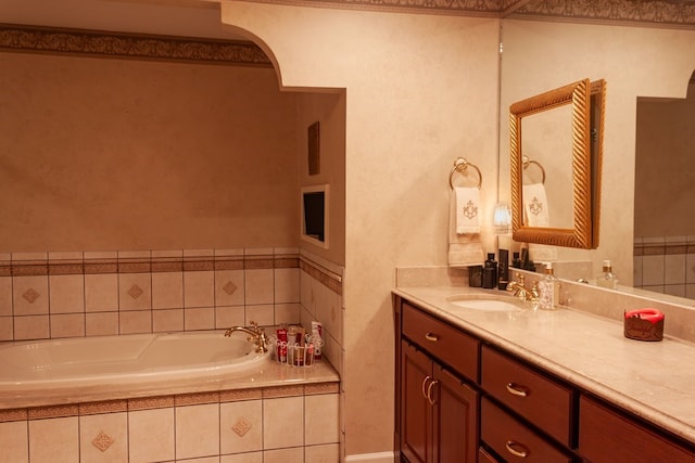 bathroom featuring vanity and a garden tub