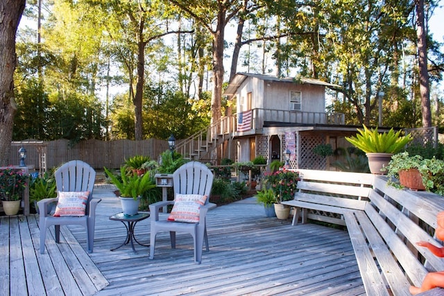 wooden deck with stairway and fence