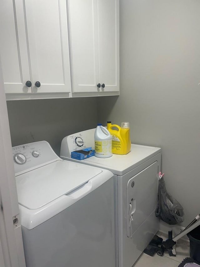 laundry area featuring cabinet space and independent washer and dryer