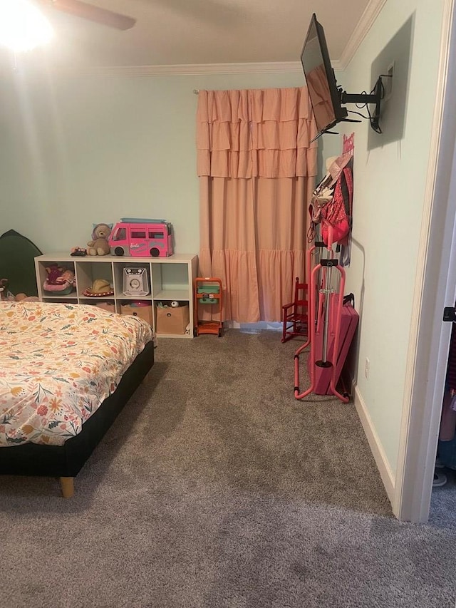 carpeted bedroom featuring baseboards and ornamental molding