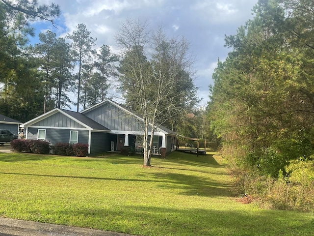 exterior space with a yard and board and batten siding