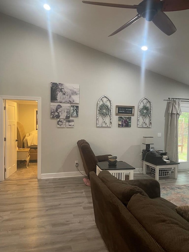 interior space featuring baseboards, ceiling fan, vaulted ceiling, recessed lighting, and wood finished floors