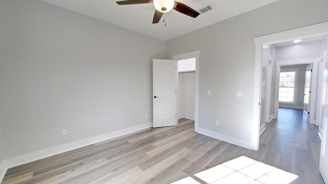 spare room featuring ceiling fan and light wood-type flooring