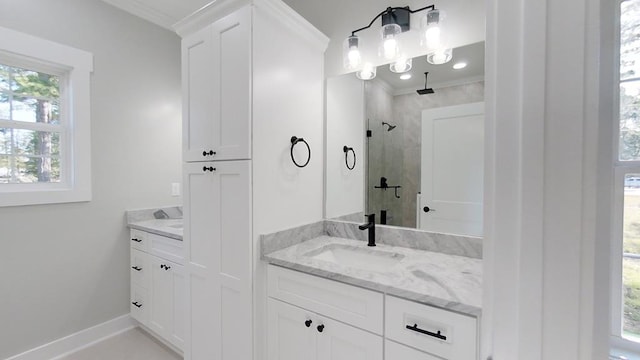 bathroom featuring vanity, crown molding, and a shower