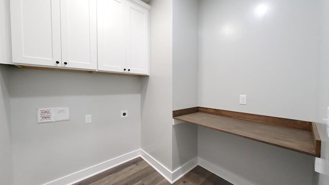 laundry room featuring cabinets, dark hardwood / wood-style floors, and electric dryer hookup