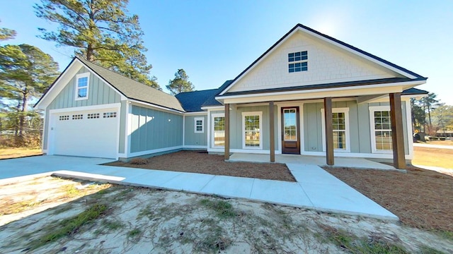 view of front of home with a garage and covered porch