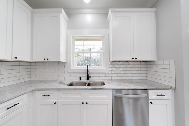 kitchen featuring white cabinetry, sink, stainless steel dishwasher, and light stone countertops