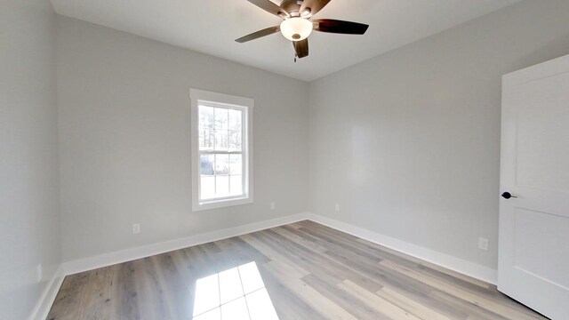 unfurnished room featuring ceiling fan and light hardwood / wood-style flooring