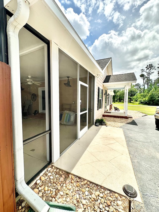 view of patio with a sunroom