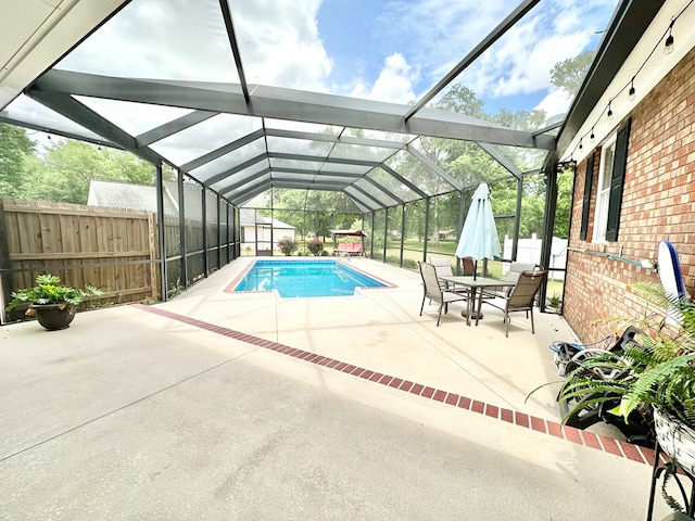 view of pool featuring a patio area and a lanai