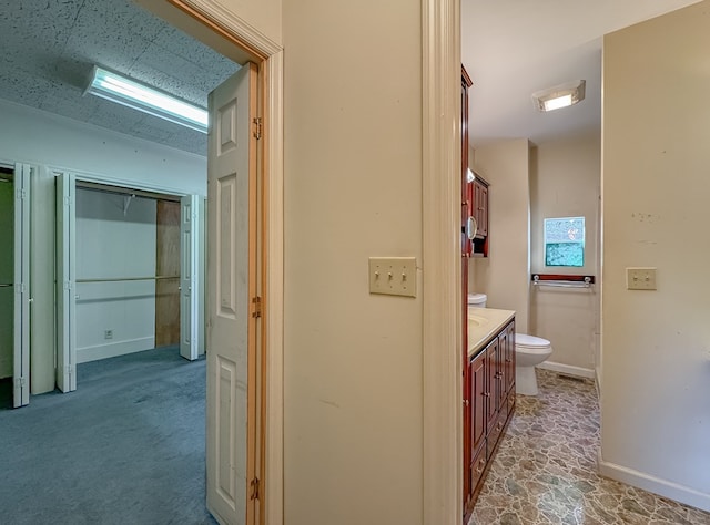 hallway featuring light carpet