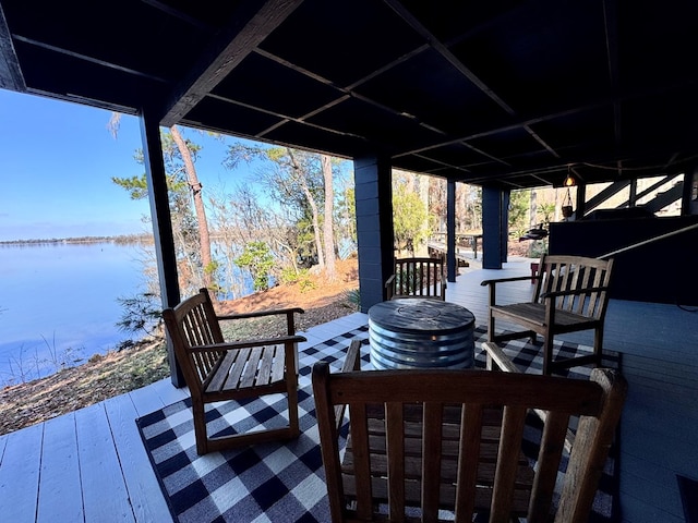 wooden terrace with a water view