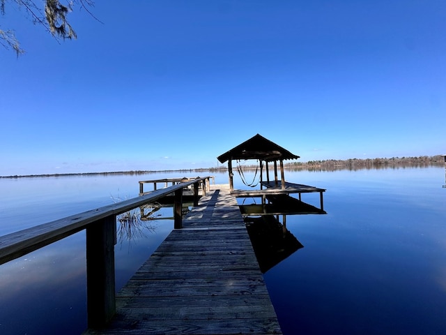 dock area featuring a water view