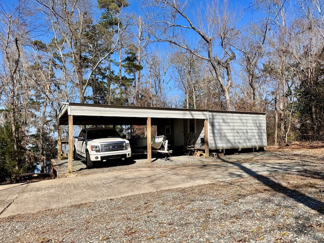 view of outbuilding with a carport