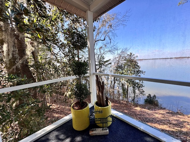 balcony featuring a water view