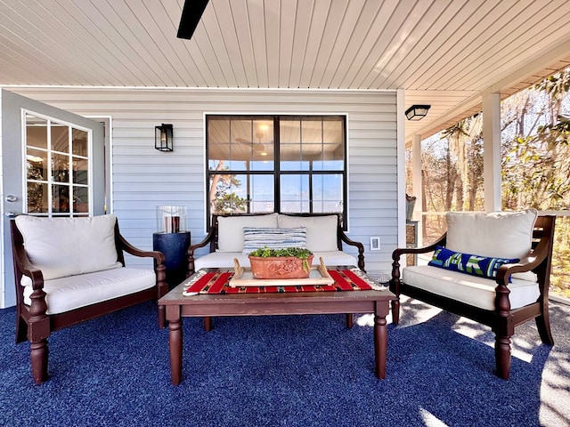 view of patio / terrace with an outdoor living space and ceiling fan