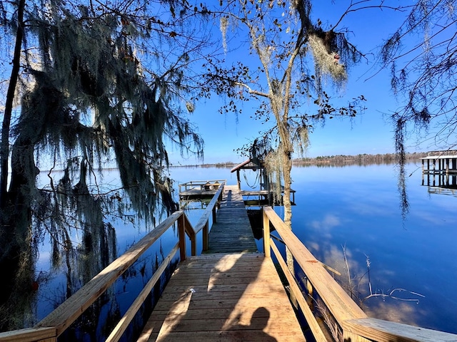 dock area featuring a water view