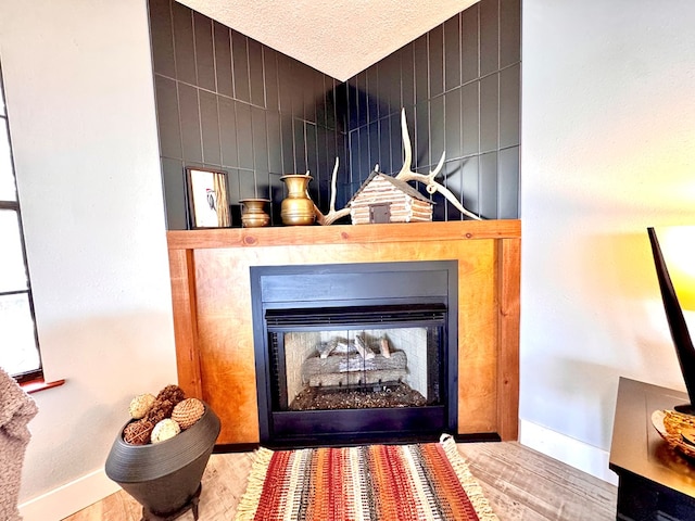 room details featuring hardwood / wood-style flooring and a fireplace