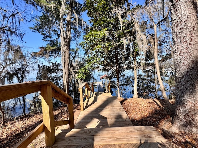 wooden deck with a boat dock