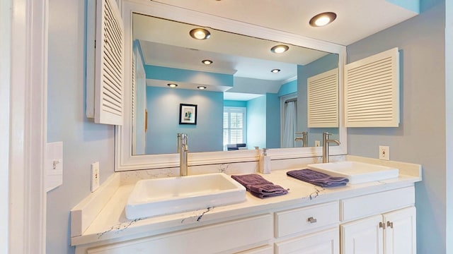 1389 Lake Front Dr, Cairo, GA 39828 - bathroom featuring double vanity and recessed lighting