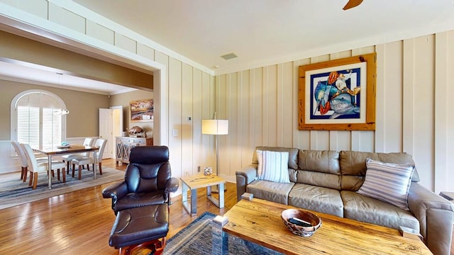 1389 Lake Front Dr, Cairo, GA 39828 - living room with crown molding, wood finished floors, and a decorative wall