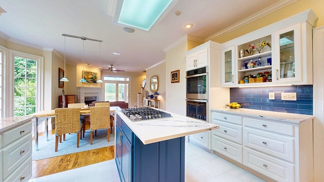 1389 Lake Front Dr, Cairo, GA 39828 - kitchen with stainless steel appliances, ornamental molding, white cabinets, open shelves, and glass insert cabinets