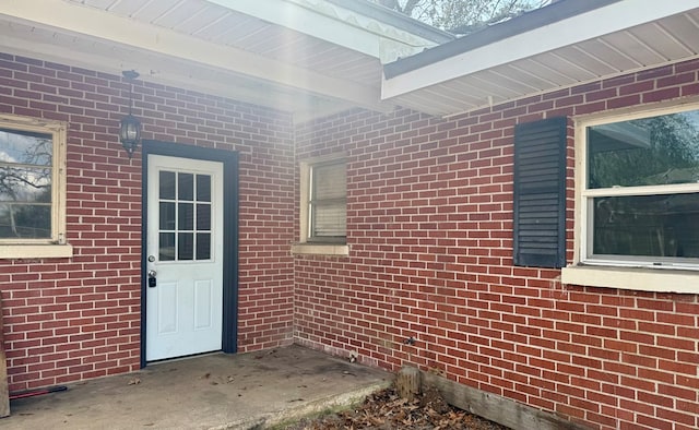 doorway to property featuring a patio area