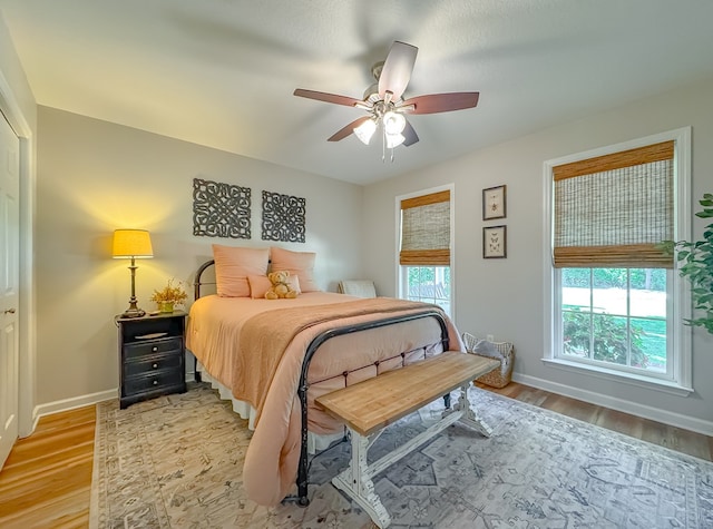 1415 College Rd, Bainbridge, GA 39819 - bedroom with light wood-type flooring, baseboards, and ceiling fan