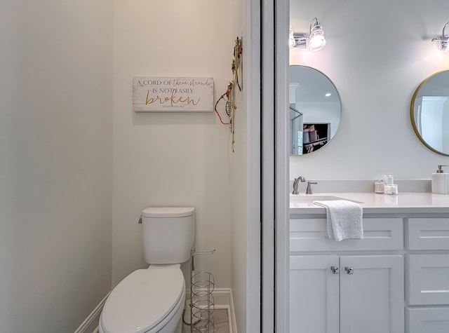 2579 Lake Douglas Rd, Bainbridge, GA 39819 - bathroom featuring toilet, vanity, and baseboards