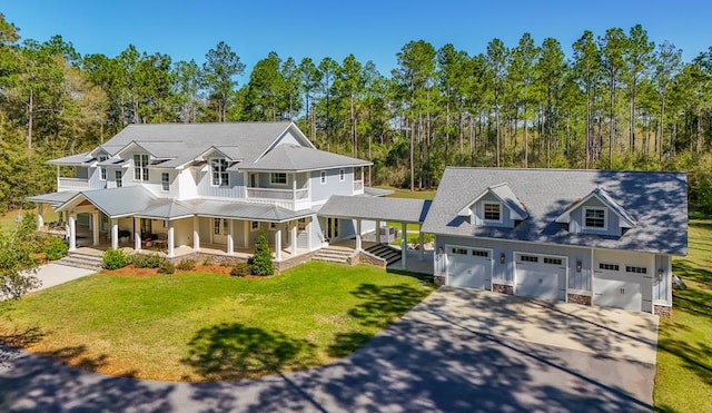 2579 Lake Douglas Rd, Bainbridge, GA 39819 - view of front of house featuring a balcony, a porch, driveway, and a front lawn