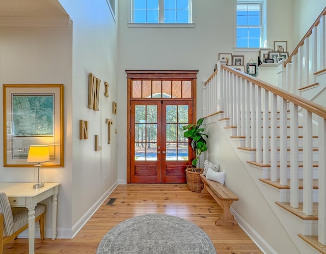 2579 Lake Douglas Rd, Bainbridge, GA 39819 - entryway featuring baseboards, stairs, wood finished floors, and french doors