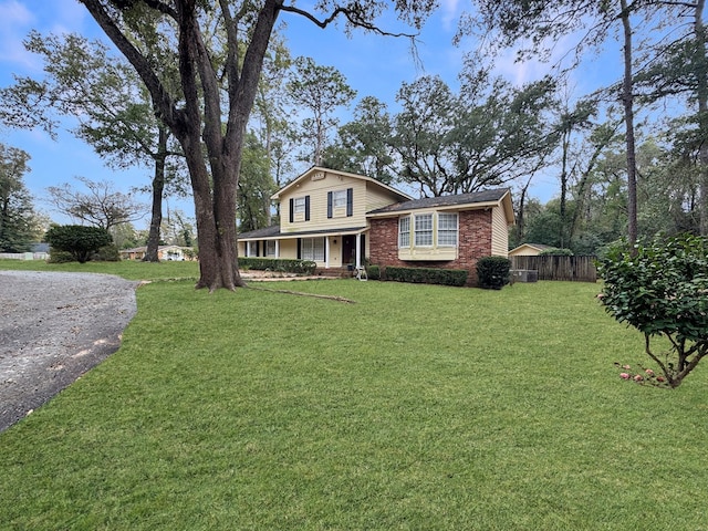 view of front of home with a porch and a front yard