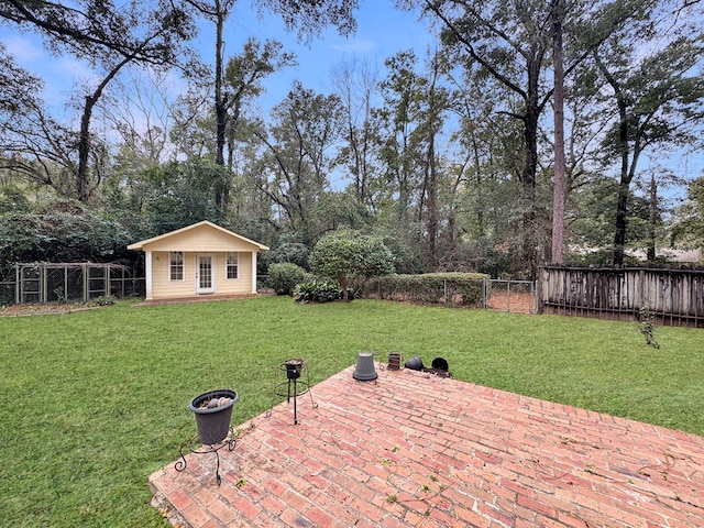 view of yard featuring an outdoor structure and a patio area