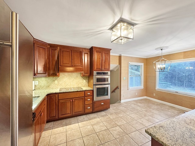 kitchen featuring a chandelier, hanging light fixtures, stainless steel appliances, light tile patterned flooring, and tasteful backsplash