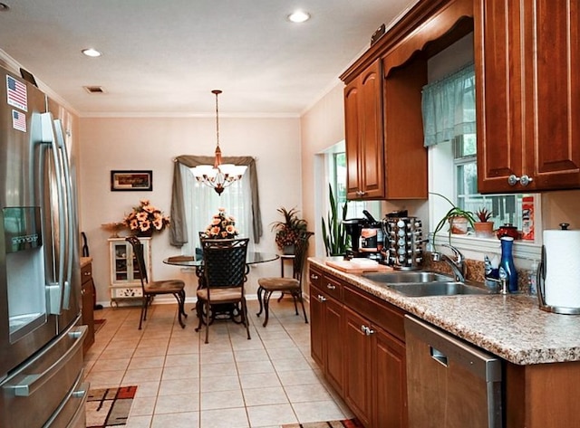 2497 Vada Rd, Bainbridge, GA 39817 - kitchen with stainless steel appliances, a chandelier, ornamental molding, light tile patterned floors, and a sink
