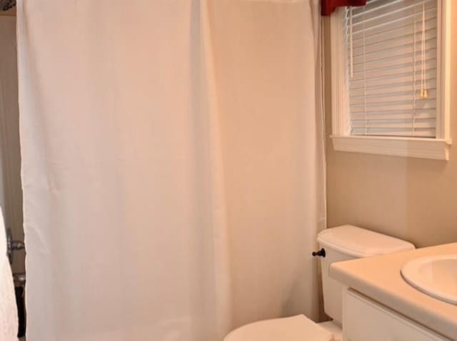 2497 Vada Rd, Bainbridge, GA 39817 - bathroom featuring toilet, vanity, and curtained shower