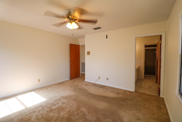 unfurnished bedroom featuring light carpet and ceiling fan