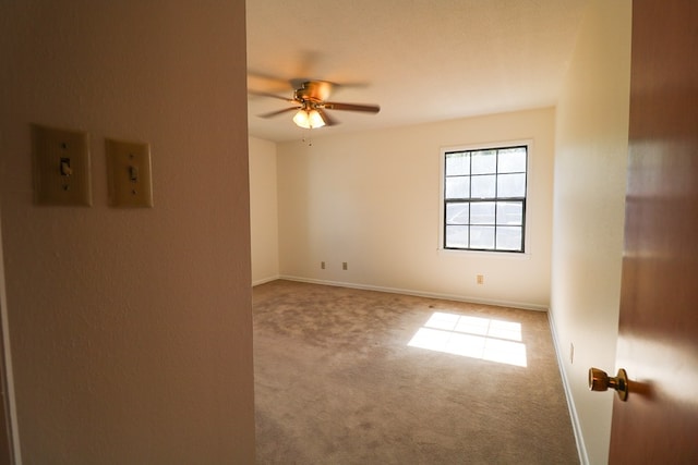 carpeted empty room with ceiling fan