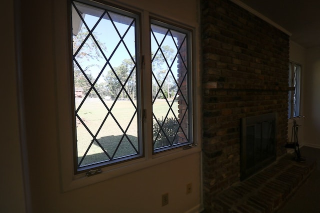 room details featuring crown molding and a fireplace