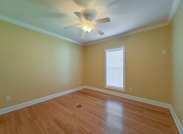 115 Lakeside Ln, Bainbridge, GA 39819 - unfurnished room with ornamental molding, baseboards, light wood-style floors, and a ceiling fan