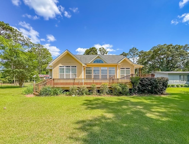 115 Lakeside Ln, Bainbridge, GA 39819 - rear view of house featuring a lawn and a wooden deck