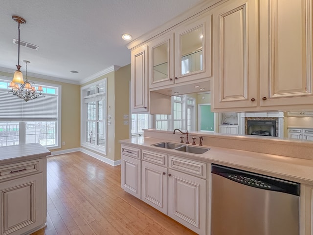 115 Lakeside Ln, Bainbridge, GA 39819 - kitchen featuring dishwasher, a sink, baseboards, ornamental molding, and light countertops