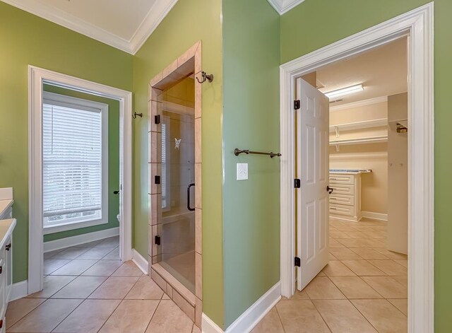 115 Lakeside Ln, Bainbridge, GA 39819 - full bathroom with crown molding, a stall shower, vanity, tile patterned flooring, and baseboards