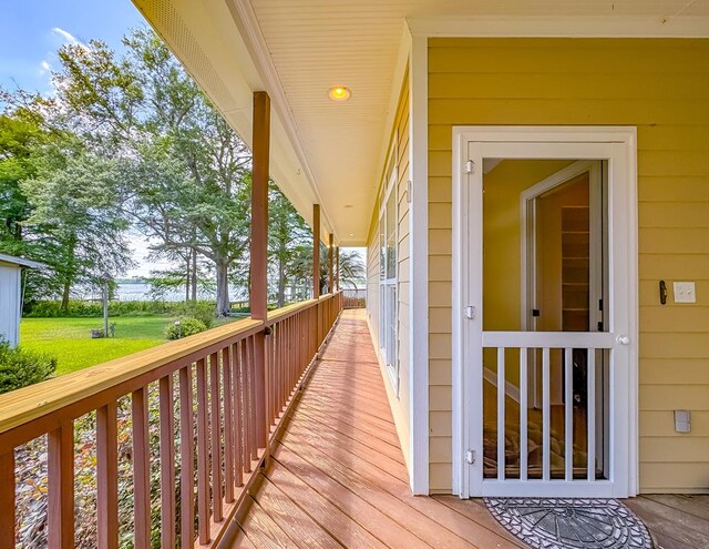 115 Lakeside Ln, Bainbridge, GA 39819 - wooden terrace with a porch and a water view
