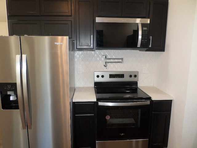 kitchen featuring tasteful backsplash and appliances with stainless steel finishes