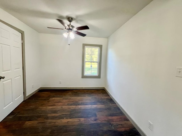 5233 Coffee Rd, Thomasville, GA 31792 - unfurnished bedroom featuring dark wood-type flooring, baseboards, and ceiling fan