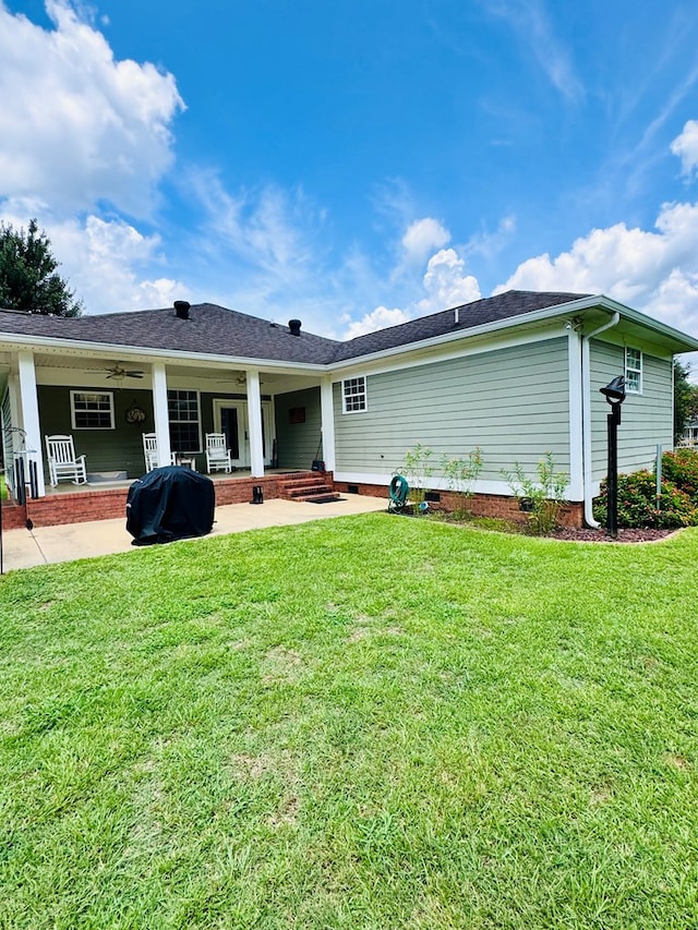 back of house with a lawn, ceiling fan, and a patio