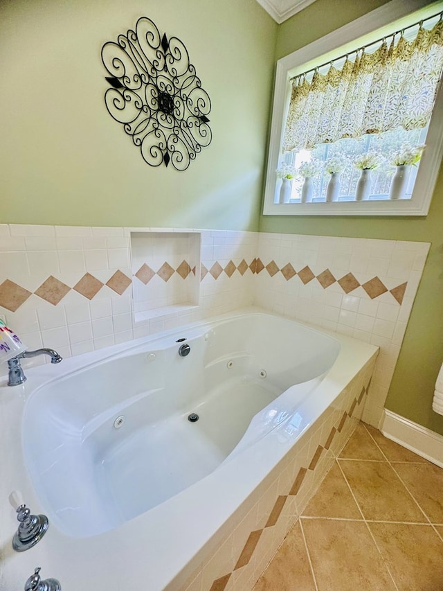 bathroom with tile patterned floors and tiled bath